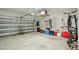 Garage with overhead storage and room for bikes at 4629 Garden Arbor Way, Bradenton, FL 34203