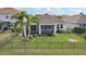 House back with a screened patio and landscaped yard at 4629 Garden Arbor Way, Bradenton, FL 34203