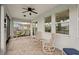 Screened porch with comfortable seating and lake view at 4629 Garden Arbor Way, Bradenton, FL 34203