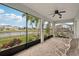 Relaxing screened porch overlooking a lake and backyard at 4629 Garden Arbor Way, Bradenton, FL 34203