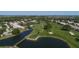 Aerial view of community with homes, golf course, and water features at 4838 88Th E St, Bradenton, FL 34211