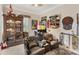 Game room with two leather chairs, a large wooden cabinet, and various wall decorations at 4838 88Th E St, Bradenton, FL 34211