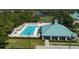 Aerial view of community pool, cabana, and surrounding landscape at 4838 88Th E St, Bradenton, FL 34211