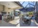 Outdoor dining area with table and chairs, adjacent to the pool at 4838 88Th E St, Bradenton, FL 34211