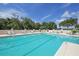 Resort-style swimming pool with lounge chairs at 4838 88Th E St, Bradenton, FL 34211