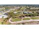 Aerial view of community, showcasing homes and golf course at 5 Pinehurst Ct, Rotonda West, FL 33947