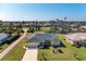 Aerial view of single-Gathering home with green roof at 5 Pinehurst Ct, Rotonda West, FL 33947