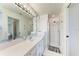 Bathroom with vanity, large mirror and shower at 5 Pinehurst Ct, Rotonda West, FL 33947