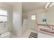 Bathroom with shower/tub combo and exterior access at 5 Pinehurst Ct, Rotonda West, FL 33947