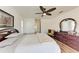 Bedroom with wood floors, double bed and access to a bathroom at 5 Pinehurst Ct, Rotonda West, FL 33947