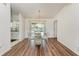 Dining room with glass table and chandelier, pool view at 5 Pinehurst Ct, Rotonda West, FL 33947