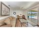 Gathering room with sliding glass doors opening to a view of the pool at 5 Pinehurst Ct, Rotonda West, FL 33947