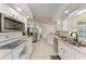 Modern kitchen with stainless steel appliances and breakfast bar at 5 Pinehurst Ct, Rotonda West, FL 33947