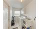 Bright laundry room with washer, dryer, and utility sink at 5 Pinehurst Ct, Rotonda West, FL 33947