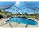 Stunning screened pool with fountain and spacious deck at 5 Pinehurst Ct, Rotonda West, FL 33947