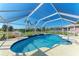 Relaxing kidney-shaped pool with screened enclosure at 5 Pinehurst Ct, Rotonda West, FL 33947