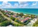 Aerial view of the community, showcasing beach access and tennis courts at 5055 Gulf Of Mexico Dr # 424, Longboat Key, FL 34228