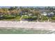 Aerial of beachfront community, showing beach access and lush landscaping at 5055 Gulf Of Mexico Dr # 424, Longboat Key, FL 34228