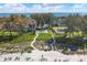 Aerial view of beachfront property with pool and tennis courts at 5055 Gulf Of Mexico Dr # 424, Longboat Key, FL 34228