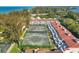 Aerial view showing multiple tennis courts and condo buildings at 5055 Gulf Of Mexico Dr # 424, Longboat Key, FL 34228