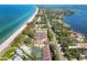 Aerial view showcasing beachfront property, tennis courts, and community at 5055 Gulf Of Mexico Dr # 424, Longboat Key, FL 34228