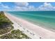 Expansive white sand beach with calm, clear water at 5055 Gulf Of Mexico Dr # 424, Longboat Key, FL 34228