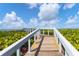 Walk to the beach on this wooden boardwalk path at 5055 Gulf Of Mexico Dr # 424, Longboat Key, FL 34228