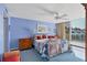 Main bedroom with wooden dresser, ceiling fan, and patchwork quilt at 5055 Gulf Of Mexico Dr # 424, Longboat Key, FL 34228