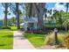 Relaxing gazebo with seating nestled in lush landscaping at 5055 Gulf Of Mexico Dr # 424, Longboat Key, FL 34228