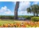 Relaxing picnic table by the ocean with lush landscaping at 5055 Gulf Of Mexico Dr # 424, Longboat Key, FL 34228