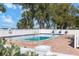 Inviting heated pool with lounge chairs and ocean view at 5055 Gulf Of Mexico Dr # 424, Longboat Key, FL 34228