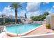 Large community pool with surrounding lounge chairs at 5055 Gulf Of Mexico Dr # 424, Longboat Key, FL 34228