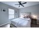 Charming bedroom with a queen-size bed and stylish decor at 5117 19Th E Ln, Bradenton, FL 34203