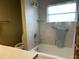 Updated bathroom featuring a shower and tub at 5327 Glen Echo Ave, Sarasota, FL 34234