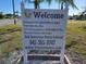 Welcome sign with community rules and contact information at 5327 Glen Echo Ave, Sarasota, FL 34234