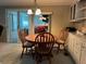 Cozy dining area with wooden table and chairs at 5327 Glen Echo Ave, Sarasota, FL 34234