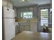 Bright kitchen with white appliances and light wood cabinets at 5327 Glen Echo Ave, Sarasota, FL 34234