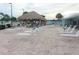 Lounge chairs and tiki hut by the pool at 5327 Glen Echo Ave, Sarasota, FL 34234