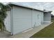 Gray vinyl-sided home with garage and walkway at 5327 Glen Echo Ave, Sarasota, FL 34234