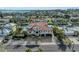 Large home with tile roof, driveway, and attached garage; located in a quiet neighborhood at 550 Yardarm Ln, Longboat Key, FL 34228