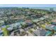 Aerial view of waterfront home community showcasing a luxurious house with a pool at 550 Yardarm Ln, Longboat Key, FL 34228