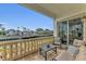 Waterfront balcony with seating and stunning water views at 550 Yardarm Ln, Longboat Key, FL 34228