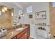 Bathroom with granite countertop, tiled shower, and modern fixtures at 550 Yardarm Ln, Longboat Key, FL 34228