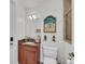 Stylish bathroom with granite vanity and beach-themed decor at 550 Yardarm Ln, Longboat Key, FL 34228