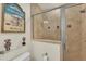 Bathroom with walk-in shower and tiled walls at 550 Yardarm Ln, Longboat Key, FL 34228