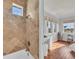 Tiled bathroom with shower/tub combo and a view from the window at 550 Yardarm Ln, Longboat Key, FL 34228