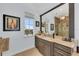 Vanity with granite countertop, modern fixtures, and large mirror at 550 Yardarm Ln, Longboat Key, FL 34228