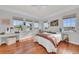 Bedroom with hardwood floors and water views at 550 Yardarm Ln, Longboat Key, FL 34228