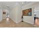 Elegant hallway with tile flooring and artwork at 550 Yardarm Ln, Longboat Key, FL 34228