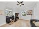 Bright home office with built-in shelving and comfortable seating at 550 Yardarm Ln, Longboat Key, FL 34228